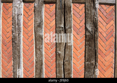 Ancient beams and brickwork on walls of St Peter's Church, Oaklands, Yateley, Hampshire, England, United Kingdom Stock Photo