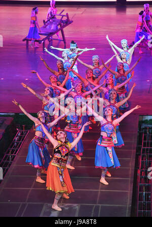 Chongqing, China's Chongqing Municipality. 31st May, 2017. A song and dance performance featuring tales about the Tujia ethnic group is staged at the Huangshui Grand Theater in Huangshui Town of Shizhu Tujia Autonomous County, southwest China's Chongqing Municipality, May 31, 2017. Credit: Wang Quanchao/Xinhua/Alamy Live News Stock Photo