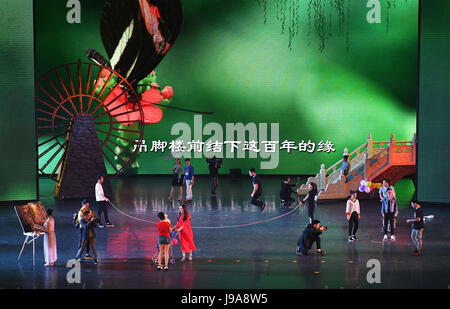 Chongqing, China's Chongqing Municipality. 31st May, 2017. A song and dance performance featuring tales about the Tujia ethnic group is staged at the Huangshui Grand Theater in Huangshui Town of Shizhu Tujia Autonomous County, southwest China's Chongqing Municipality, May 31, 2017. Credit: Wang Quanchao/Xinhua/Alamy Live News Stock Photo