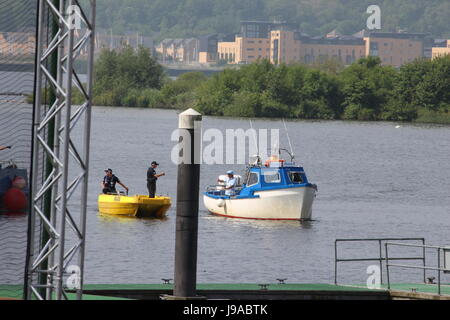 Cardiff Bay, Wales, UK. 1st June 2017. Police give a thumbs up to a civilian boat prior to the arrival of Ian Rush with the Champions League Trophy onto the temporary floating football pitch outside the National Assembly for Wales in Cardiff Bay, Wales, UK Credit: Elizabeth Foster/Alamy Live News Stock Photo