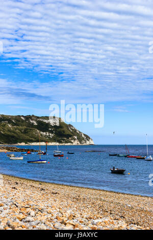 Sailing boats moored in the bay at Ringstead, Dorset, England, UK, on a sunny summer day Stock Photo