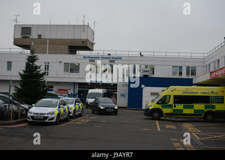 Northampton General Hospital police and ambulance vehicles parked Stock Photo