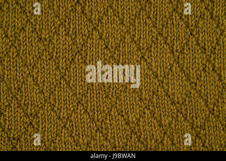 Green knitted yarn as a seamless background Stock Photo