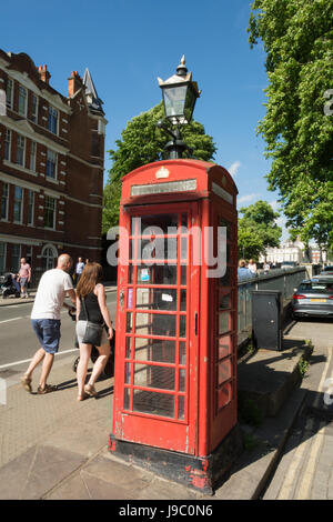 A red phone box near Richmond Bridge in London, UK Stock Photo