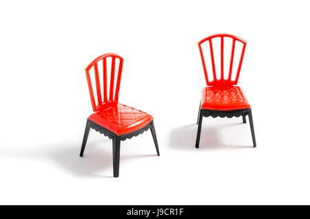 Red plastic chair on white background Stock Photo