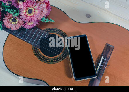 play guitar and composed songs using the phone. Stock Photo
