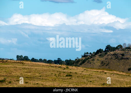 View  of rural autumn winter cloudy sky hills and valley landscape in Bothas Hill, South Africa Stock Photo