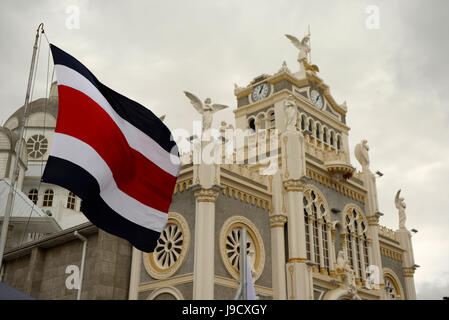 The Costa Rican flag flies over the Basillica of Our Lady Los Angeles in Cartago, Costa Rica. Stock Photo