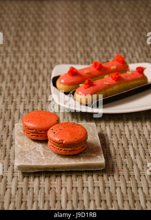 Green Tea with red bean roll cake and latte art on wood table. Stock Photo