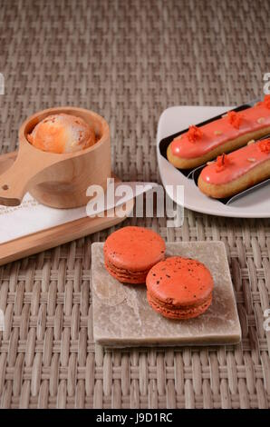 Green Tea with red bean roll cake and latte art on wood table. Stock Photo