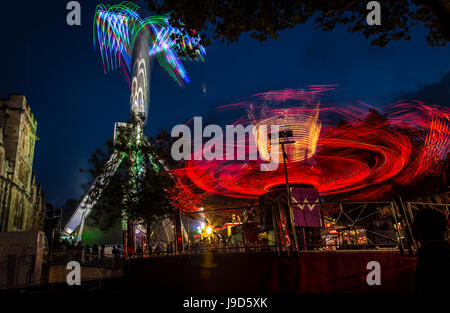 The light traces from 'Evolution' in the foreground and 'Air' in the background at St Giles fair, Oxford.  September 2012 Stock Photo