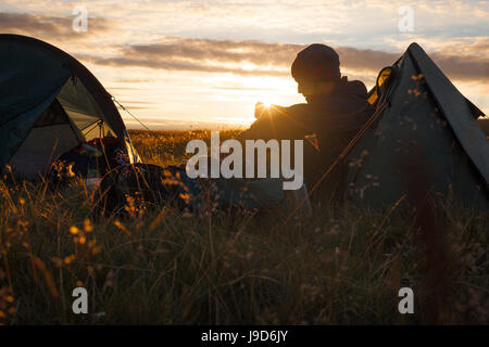 A camper sits in the evening sun, Picws Du, Black Mountain, Brecon Beacons National Park, Wales, United Kingdom, Europe Stock Photo