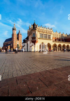 Main Market Square, St. Mary Basilica and Cloth Hall, Cracow, Lesser Poland Voivodeship, Poland, Europe Stock Photo