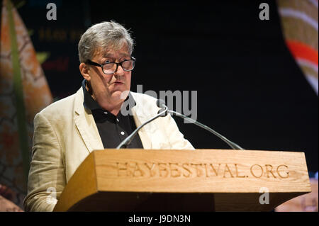 Stephen Fry reading from lectern at Letters Live event at Hay Festival 2017 Hay-on-Wye Powys Wales UK Stock Photo