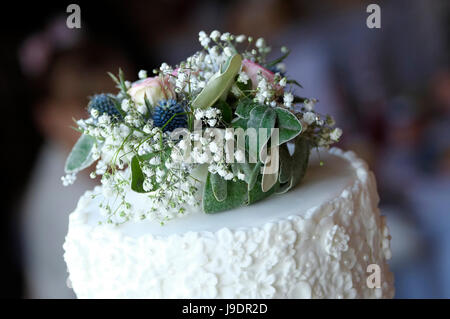 flower display on top of wedding cake Stock Photo