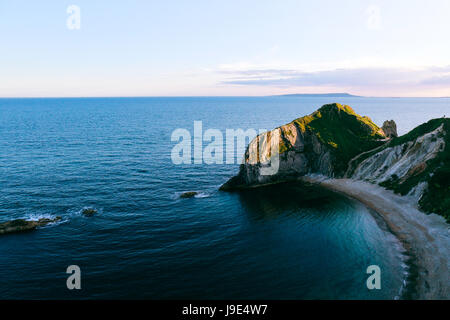 Bird's eye view over blue sea and Man O'War Beach, Dorset, Jurassic Coast, UK at sunset Stock Photo