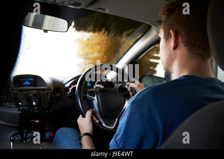 Motorist Driving Through Automated Car Wash Stock Photo