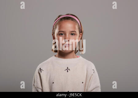Waist up portrait of a nine year old white girl Stock Photo