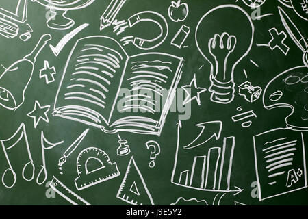 Drawn symbols of school subjects on a chalkboard, close up Stock Photo