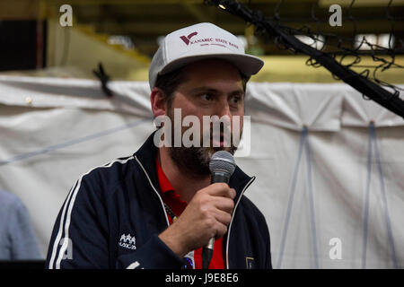 Hugh from Goldie Lookin Chain commentates during the Match for Manchester celebrity and community football match fundraiser for the Manchester Emergen Stock Photo