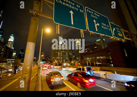 driving on Brooklyn bridge towards Manhattan at night Stock Photo