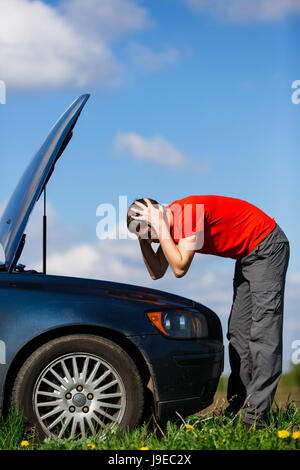 Frustrated man near broken car Stock Photo