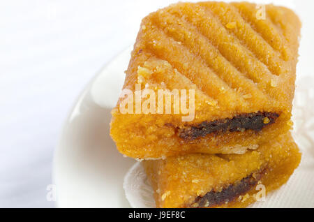 Makroudh - traditional North African pastry done with dates and almonds, eaten in Algeria,Tunisia and Libya.Closeup Stock Photo