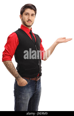 Tattooed guy gesturing with his hand and looking at the camera isolated on white background Stock Photo