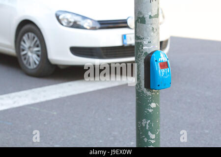 Hand pressing sensor of pedestrian light. Stock Photo