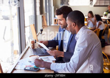 Two Businessmen Having Informal Meeting In Coffee Shop Stock Photo