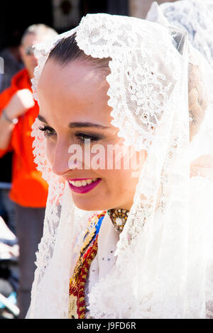 A young woman dressed in the traditonal costume of the annual Las Fallas (The Fires) celebration in Valencia, Spain. Stock Photo