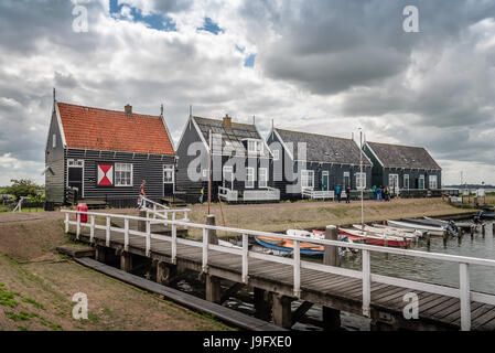Marken, Netherlands - August 08, 2016. Picturesque traditional houses in the fishing harbour of Marken. It is known for its characteristic wooden hous Stock Photo