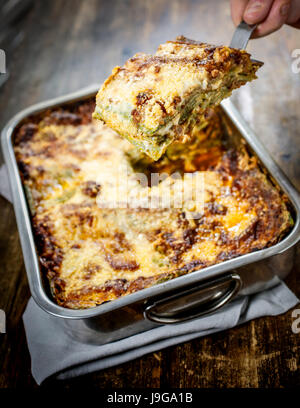 Lasagna bolognese. Typical homemade fresh green pasta cooked in oven. Stock Photo