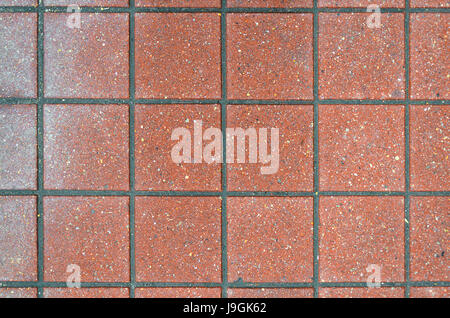 Red brick paving stones on a sidewalk. Abstract background texture Stock Photo