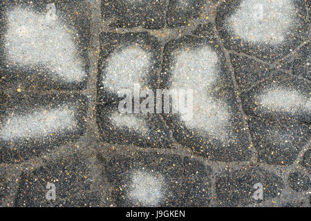Grey cracked destroyed asphalt Stock Photo