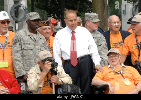 Former U.S. Senator and veteran Bob Dole, center, poses for a group photo with World War II veterans from the Northwest Ohio division of the 2009 Honor Flight World War II Memorial Tour September 16, 2009 in Washington, DC. Honor Flight is a volunteer program that brings veterans to Washington to visit the World War II memorial.
