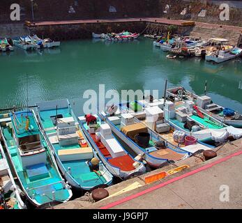 LIUQIU, TAIWAN -- SEPTEMBER 23:  Small fishing boats on the island of Liuqiu seek refuge in port to take shelter from the  approaching typhoon Usagi,  Stock Photo