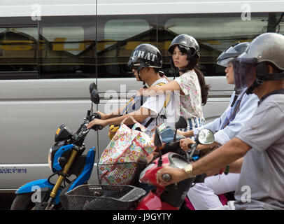THAILAND, CHIANG MAI, NOV 07 2014, Road traffic in city. Motorcyclists wait at a junction in Chiang Mai, Thailand. Stock Photo