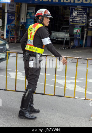 THAILAND, CHIANG MAI, NOV 07 2014, Police officers in the streets of the city builds handrails for traffic restrictions, Stock Photo