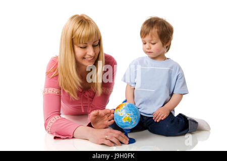 Happy mother holding globe with son isolated on white Stock Photo