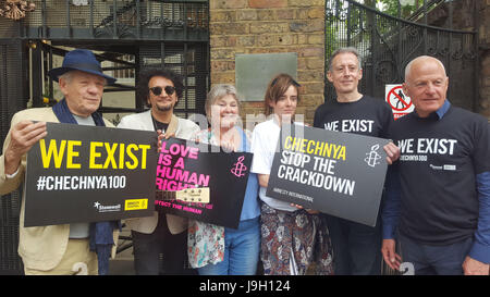 Sir Ian McKellen (left), human rights campaigner Peter Tatchell, (second right) and Lord Michael Cashman (right) as they join protesters outside the Russian embassy in London voicing their anger against a 'purge' of gay men in Chechnya. Stock Photo