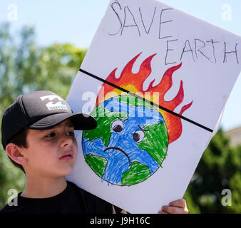 New York, USA. 29th Apr, 2017. File photo taken on April 29, 2017 shows a child holding a placard during a demonstration against U.S. President Donald Trump's climate policies in Los Angeles, the United States. U.S. President Donald Trump announced U.S. withdrawal from Paris Agreement on climate change on June 1. Credit: Zhao Hanrong/Xinhua/Alamy Live News Stock Photo