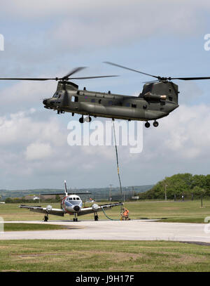 Culdrose, UK. 1st Jun, 2017. Final Flight – but with a hot future. Two retired aircraft made their final flights from RNAS Culdrose today with the helping hand of a Chinook helicopter. The old Royal Navy aircraft were moved across the Lizard Peninsula as ‘under-slung loads’ by a heavy lift RAF helicopter, and taken to their final resting place at Predannack airfield.  Credit: Bob Sharples/Alamy Live News Stock Photo