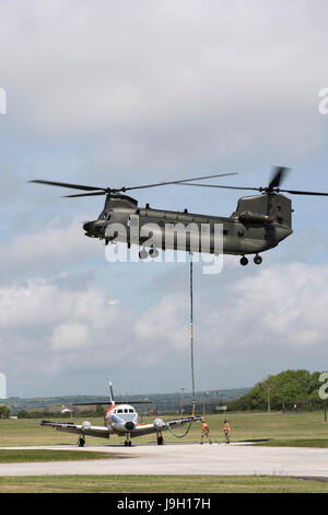 Culdrose, UK. 1st Jun, 2017. Final Flight – but with a hot future. Two retired aircraft made their final flights from RNAS Culdrose today with the helping hand of a Chinook helicopter. The old Royal Navy aircraft were moved across the Lizard Peninsula as ‘under-slung loads’ by a heavy lift RAF helicopter, and taken to their final resting place at Predannack airfield.  Credit: Bob Sharples/Alamy Live News Stock Photo