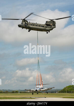 Culdrose, UK. 1st Jun, 2017. Final Flight – but with a hot future. Two retired aircraft made their final flights from RNAS Culdrose today with the helping hand of a Chinook helicopter. The old Royal Navy aircraft were moved across the Lizard Peninsula as ‘under-slung loads’ by a heavy lift RAF helicopter, and taken to their final resting place at Predannack airfield.  Credit: Bob Sharples/Alamy Live News Stock Photo