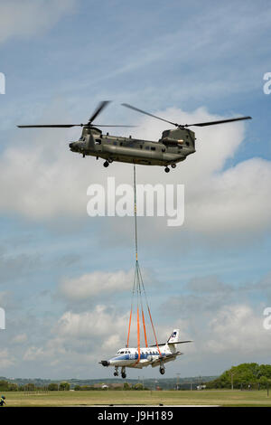 Culdrose, UK. 1st Jun, 2017. Final Flight – but with a hot future. Two retired aircraft made their final flights from RNAS Culdrose today with the helping hand of a Chinook helicopter. The old Royal Navy aircraft were moved across the Lizard Peninsula as ‘under-slung loads’ by a heavy lift RAF helicopter, and taken to their final resting place at Predannack airfield.  Credit: Bob Sharples/Alamy Live News Stock Photo