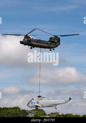 Culdrose, UK. 1st Jun, 2017. Final Flight – but with a hot future. Two retired aircraft made their final flights from RNAS Culdrose today with the helping hand of a Chinook helicopter. The old Royal Navy aircraft were moved across the Lizard Peninsula as ‘under-slung loads’ by a heavy lift RAF helicopter, and taken to their final resting place at Predannack airfield.  Credit: Bob Sharples/Alamy Live News Stock Photo