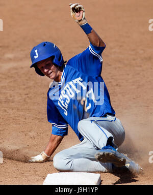 Fort Myers, Florida, USA. 1st June, 2017. MONICA HERNDON | Times.McGuire Weaver (27) of Jesuit High School Tigers slides into third during the fifth inning of the class 6A semifinal at Hammond Stadium in Fort Myers, Fla., on June 1, 2017. Jesuit defeated Dunedin 7 to 0. Credit: Monica Herndon/Tampa Bay Times/ZUMA Wire/Alamy Live News Stock Photo