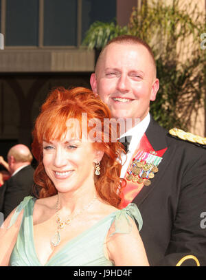 June 2, 2017: FILE PHOTO: American comedian KATHY GRIFFIN, who sparked outrage by staging a photoshoot with PresidentTrump's severed head, has accused the president of trying to destroy her. Griffin, 56, broke down in tears on Friday at a press conference called with womens' rights lawyer Lisa Bloom. The Secret Service, she said, have been involved, something they refused to confirm. PICTURED: Aug 27, 2006; Los Angeles, CA, USA; Emmys 2006: Comedian KATHY GRIFFIN and guest arriving at the 58th Annual Primetime Emmy Awards, held at the Shrine Auditorium in Los Angeles. Mandatory Credit: Photo b Stock Photo
