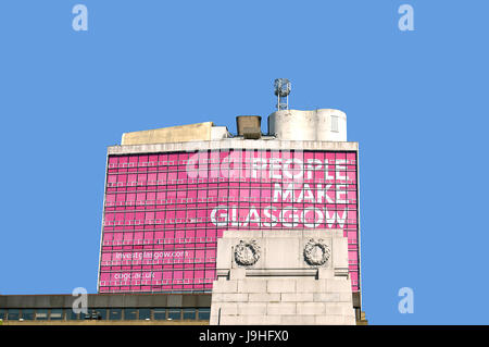 GLASGOW, SCOTLAND - 3 MAY 2017: A view over the cenotaph in George Square to the city's advertising slogan since 2013, "People Make Glasgow" displayed Stock Photo